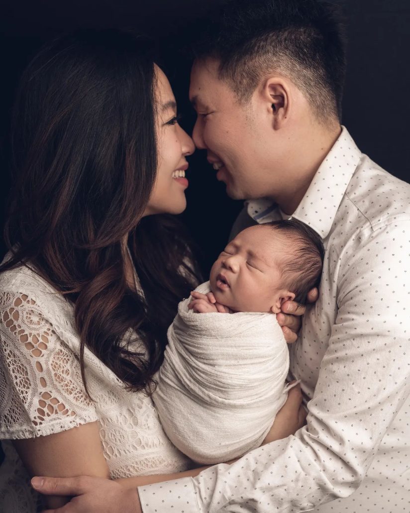 Happy family with newborn baby boy